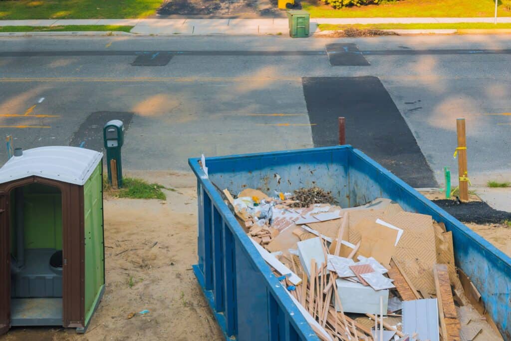 Roll-off dumpster placed at a multi-unit property for a tenant turnover in Cedar Valley