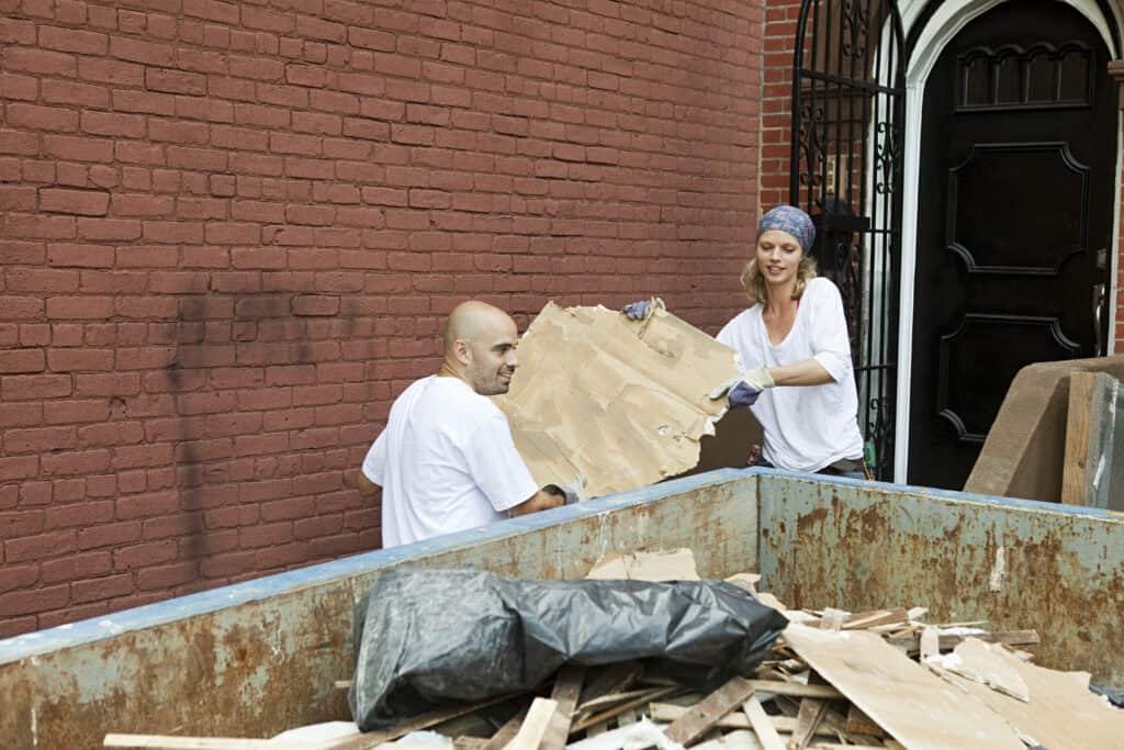 What Fits in a 30 Yard Dumpster? 2 Construction and roofing debris loaded into a 30 yard roll-off dumpster