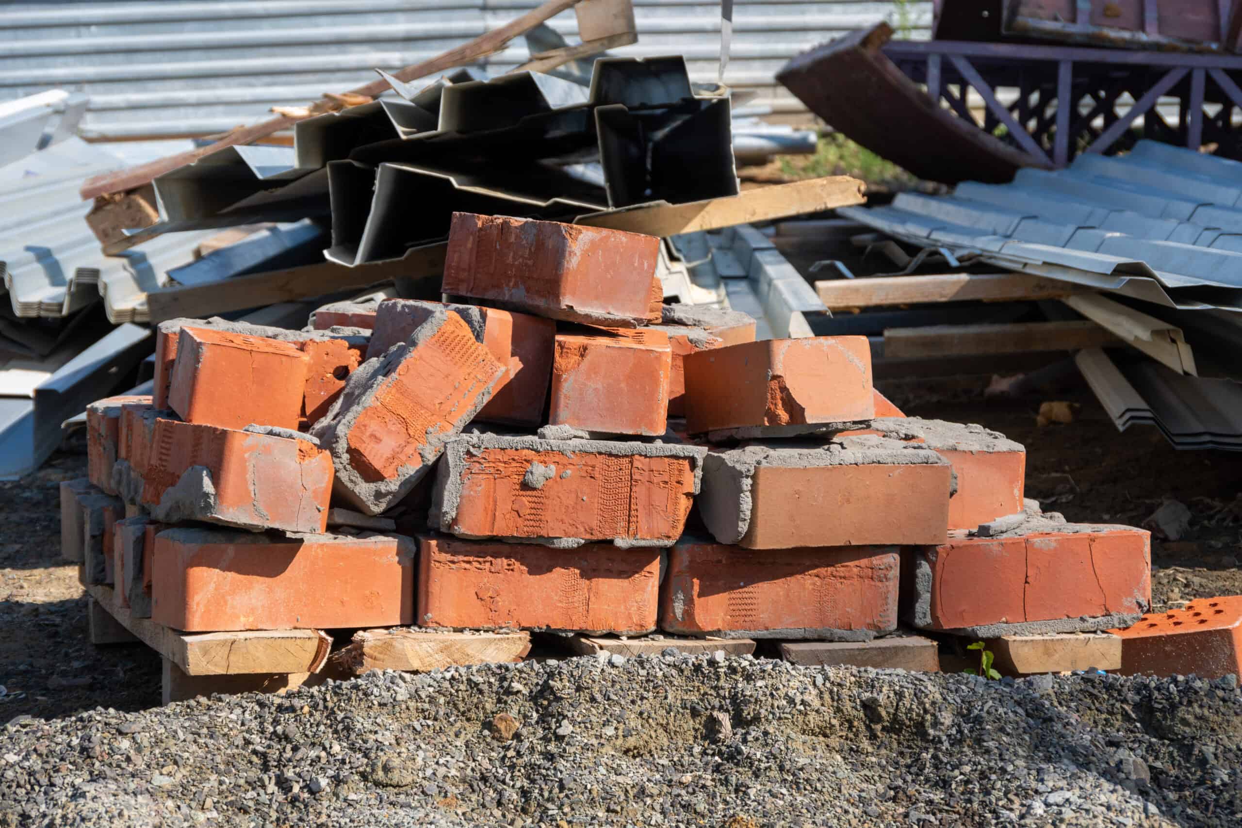 Concrete, Dirt, and Bricks: Where They Go When a Dumpster Won't Take Them 1 Broken concrete, soil, and bricks separated from renovation debris for disposal in the Cedar Valley