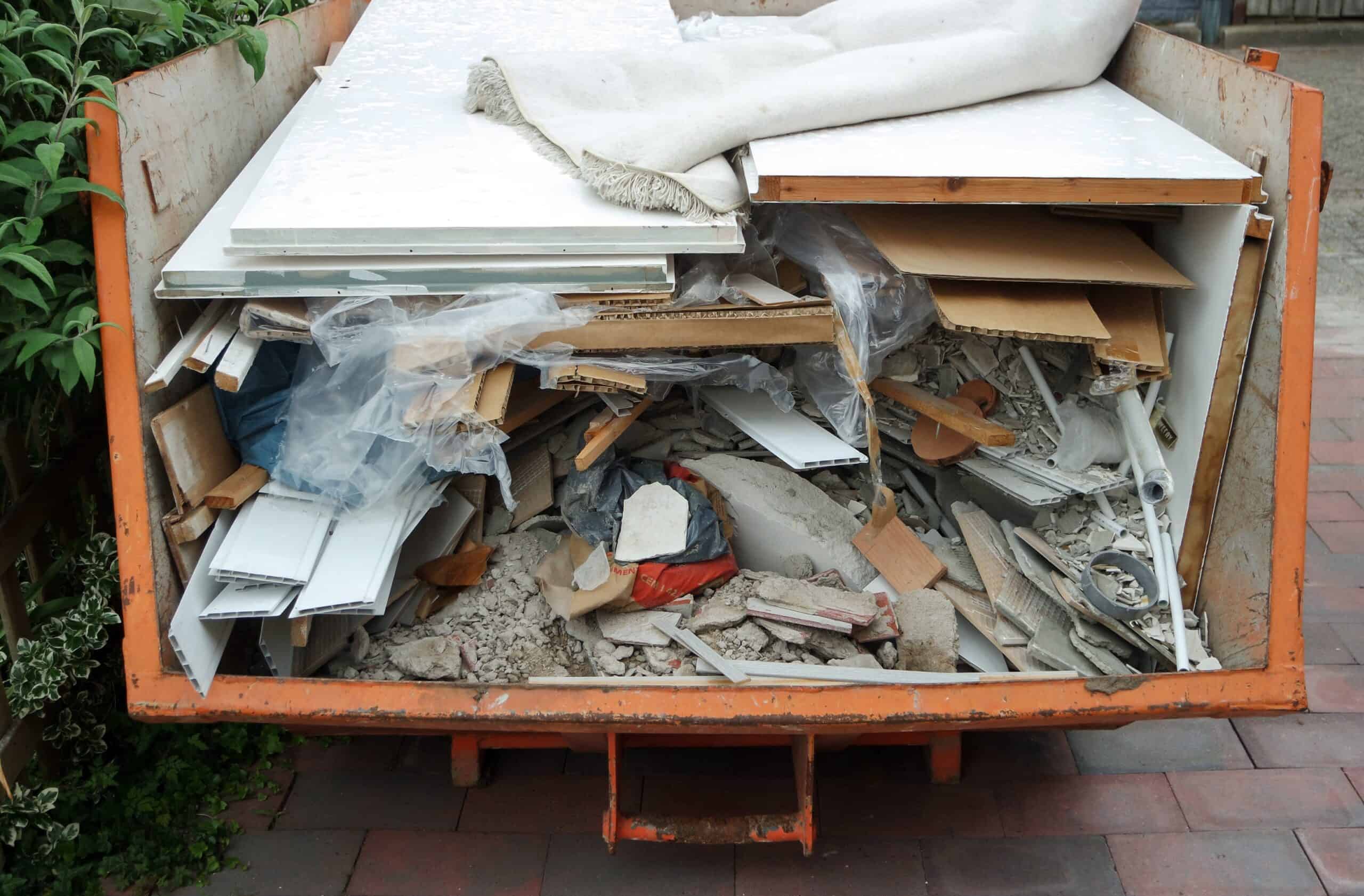 One Dumpster vs. Multiple Dump-Run Trips 1 Roll-off dumpster filled with furniture and boxes from a cleanout